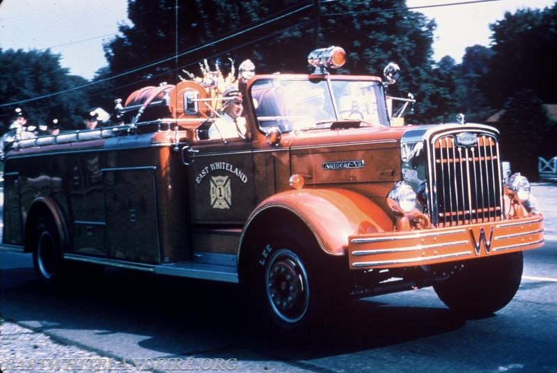 1954 Autocar. The first apparatus owned by East Whiteland Fire Company. Later became Engine 50. Gasoline engine replaced with diesel engine in 1972. Seen here on September 10, 1960 in the first East Whiteland parade on Route 30.