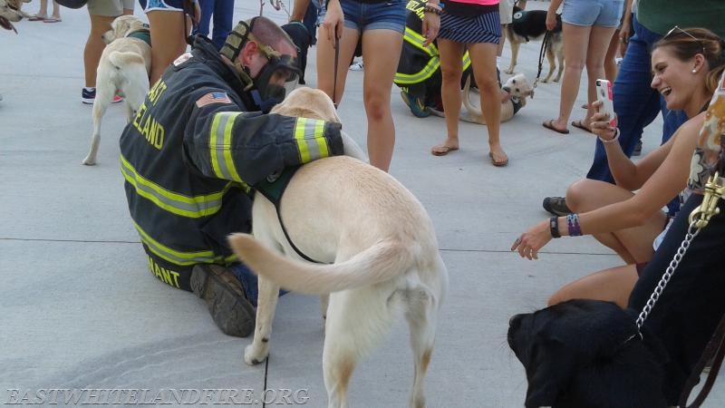 Lt. Dan Sheridan with one of the visiting service dogs at Station 5.