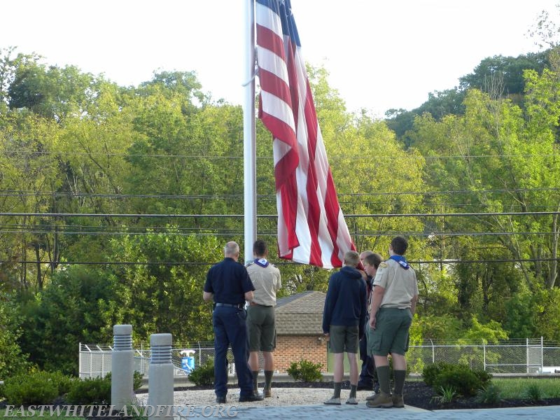 East Whiteland Fire Company Career Captain Mike Risell standing with Boy Scout Troop 76 after raising the American flag at Station 5, at a memorial presentation remembering the 9-11 tragedy.